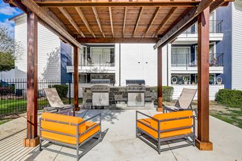 Covered picnic lounge area with bbq grills